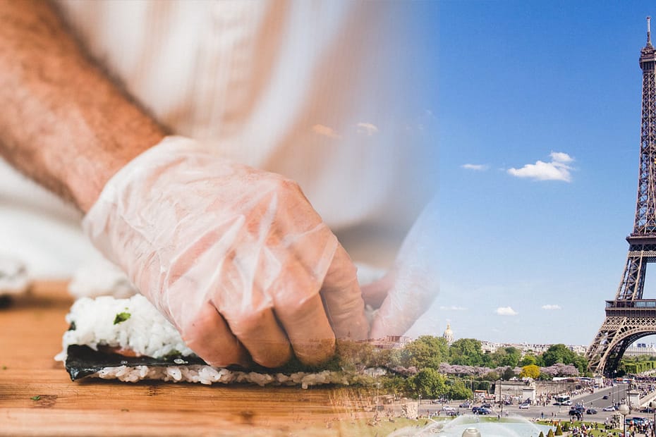 Un cuisinier fait des sushis avec la Tour Eiffel en arrière-plan